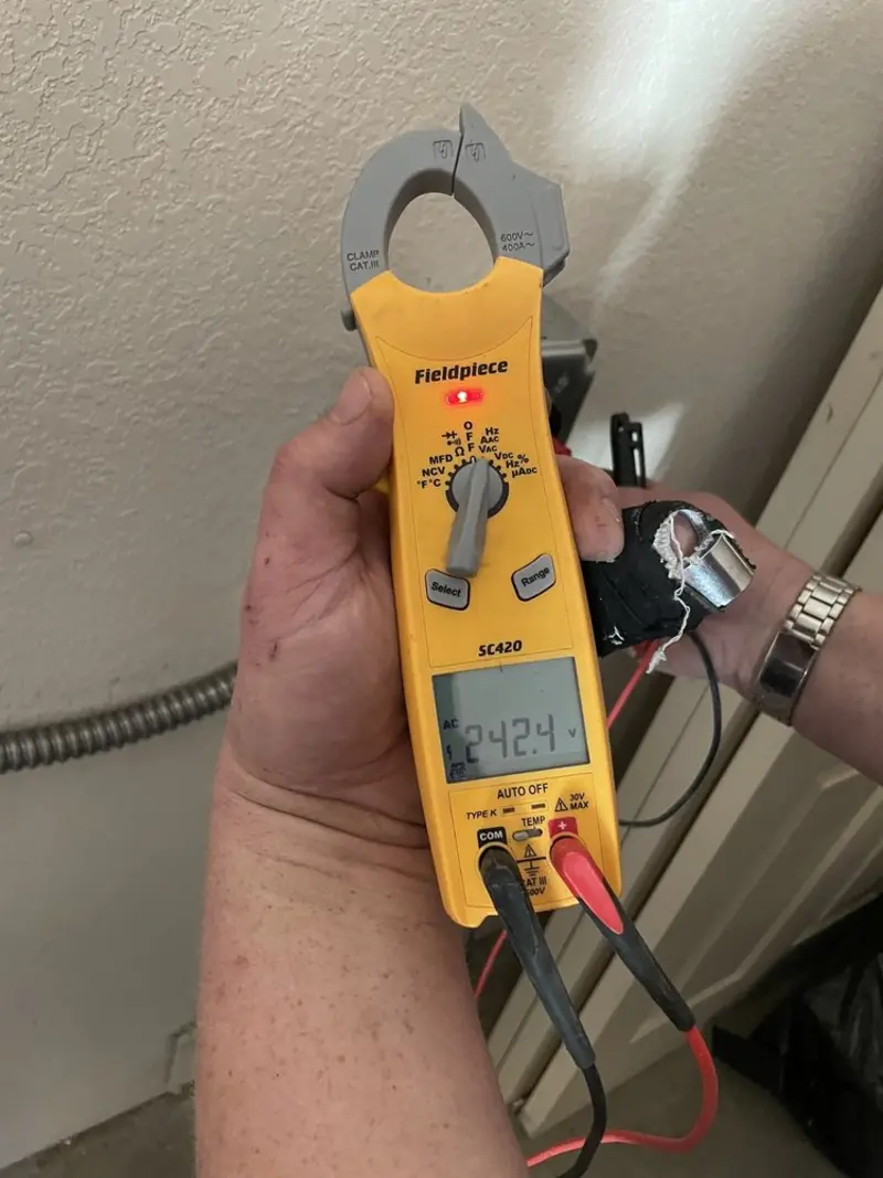 Voltage testing with clamp meter during Whole House Surge Protector in Crawfordville